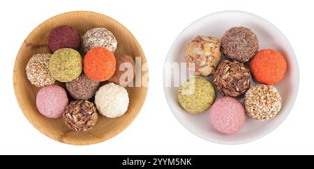 A variety of different truffles in a wooden and ceramic bowl Isolated on a white background. Top view. Flat lay. Stock Photo