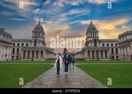 Old Royal Naval College at Sunset with Couple Walking in Greenwich Stock Photo