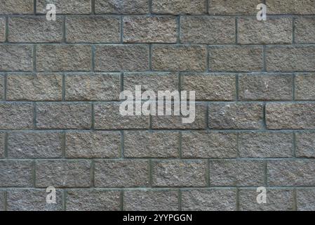 Wall made of stone blocks. Perfect tiles on all sides. Stone wall texture background. Background texture from stone wall blocks. Stock Photo