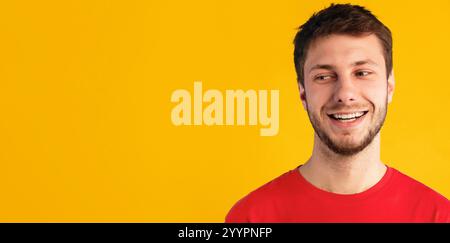 Smiling confident man looking at copy space on blue background Stock Photo