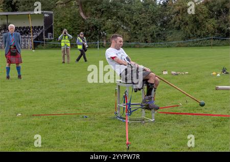 Stirling, Scottish Highlands and  Islands, Scotland - August 19th 2023 - Disabled veteran taking part in annual Stirling Highland games using adaptive Stock Photo