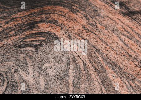 pantone 2025. Surface displaying intricate natural patterns. Stone features various shades of brown and beige with some lighter and darker swirls Stock Photo