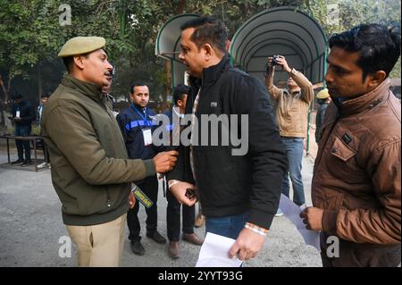 Noida, India. 22nd Dec, 2024. NOIDA, INDIA - DECEMBER 22: Aspirants appearing for the UPPSC PCS Prelims exam 2024 are frisked and their documents are verified by police personnel at Government Post Graduate College sector 39 on December 22, 2024 in Noida, India. (Photo by Sunil Ghosh/Hindustan Times/Sipa USA) Credit: Sipa USA/Alamy Live News Stock Photo