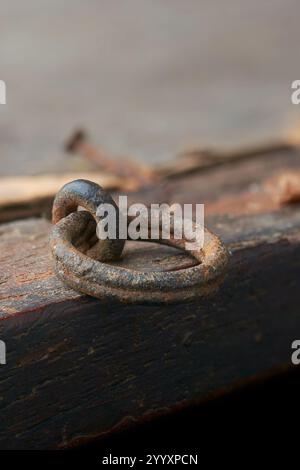 close-up of old rusty metal ring used to hang picture frame to wall securely, soft focus with blurry background and copy space Stock Photo
