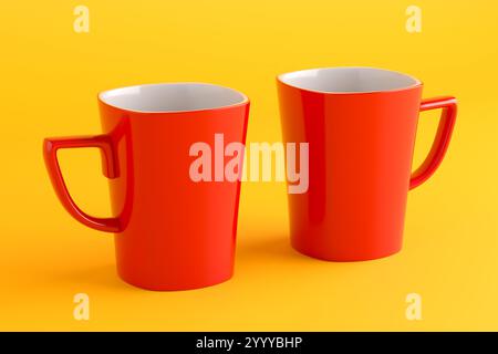 Two red mugs standing together on a yellow background, symbolizing couple, friendship, or teamwork, perfect for lifestyle or relationship themes. 3D r Stock Photo