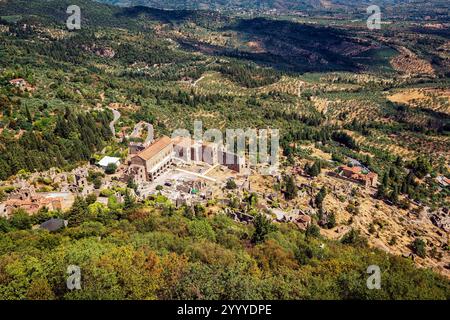 A stunning aerial view of the Palace of the Despots in Mystras, Greece, surrounded by ancient ruins and lush greenery. Stock Photo