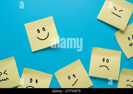 Adhesive notes or Sticky notes with different sad and happy emotions Stock Photo