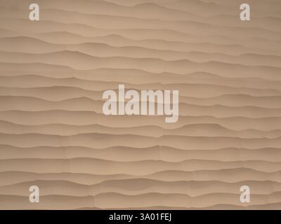 Textured tan wall with linear ridges photographed at eye level, close up. Stock Photo