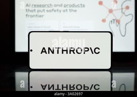 Anthropic AI logo displayed on a smartphone screen with a blurred background. March 2, 2025 Stock Photo