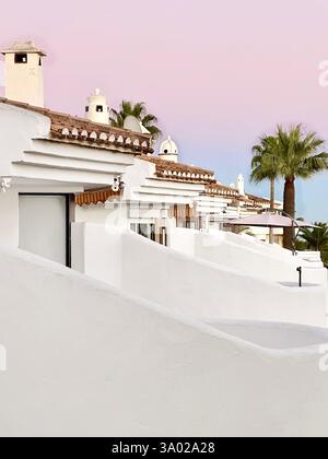 Colorful Pink Blue Sunset Sky Over Spain Architecture Exotic Palm Trees Stock Photo
