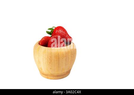 Strawberry in wooden bowl isolated on white background with clipping path Stock Photo