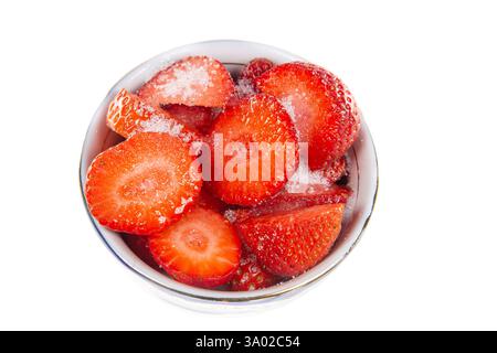 Strawberries in a bowl with sugar isolated on white background. Stock Photo