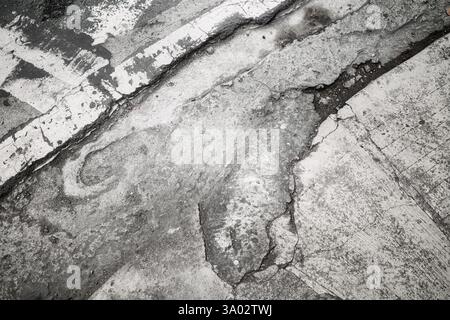 Grunge cracked asphalt background or texture. Stock Photo