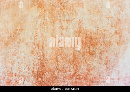 shabby washed out whitewash on orange wall texture and background Stock Photo