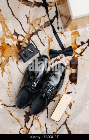 Luxurious black patent leather men's dress shoes on carpet Stock Photo