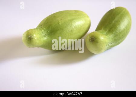 Green vegetable, kakri cucumbers cucumis utilissimus on white background Stock Photo