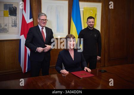London, United Kingdom. 01st Mar, 2025. With Ukrainian Finance Minister Sergii Marchenko watching online, U.K Chancellor of the Exchequer Rachel Reeves, center, signs loan guarantees for Ukraine at #10 Downing Street, March 1, 2025 in London, United Kingdom. Ukrainian President Volodymyr Zelenskyy, right, and British Prime Minister Keir Starmer, left, look on during the process. Credit: Pool Photo/Ukrainian Presidential Press Office/Alamy Live News Stock Photo