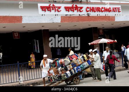 Tiffinwala or dabbawala carrying lunchboxes in crate on handcart, Bombay Mumbai, Maharashtra, India, Asia Stock Photo