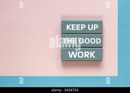 Keep up the good work, text is written on wooden blocks, Business concept, Motivating slogan, work commitment, good job. copy space, Business backgrou Stock Photo
