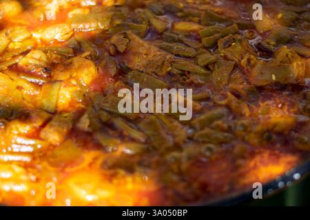 Vegetable Stew: Rich Tomato Broth and Paella Stock Photo