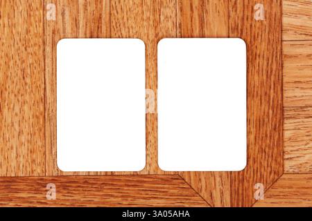 Two blank white rectangular cards on wooden surface, empty paper mockup template with copy space, top view shot, minimalist design, business branding Stock Photo