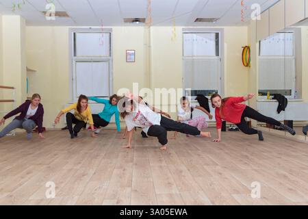 Female hip hop dancers practicing breakdance moves in dance studio. Moscow, Russia September 28, 2017 Stock Photo