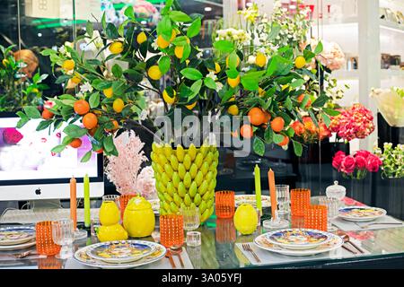 lemon and orange tree in the center of the serving table in the interior home soft slippers on a shelf in the interior Stock Photo