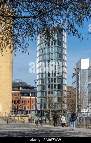 View of The Eye on Glass Wharf, a waterside apartment building possessing a striking glass-fronted design and curved structure, Bristol, England Stock Photo