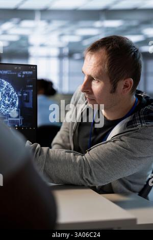 Technicians doing brainstorming in data center, optimizing IT infrastructure using network management skills. Server room teamworking colleagues upgrading gear, reducing operational costs Stock Photo