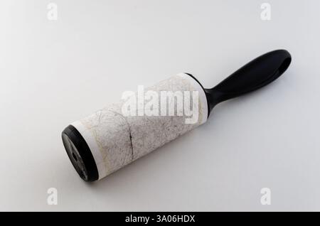 Close-up front view of a used fabric sicky roller isolated on a white background Stock Photo