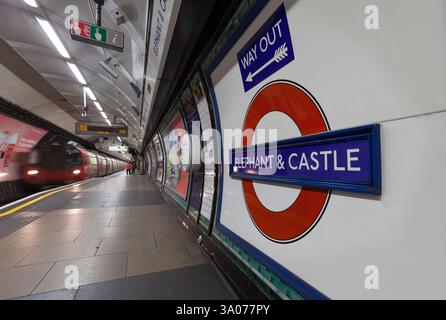 London Underground 1995 stock Northern line train at Elephant and Castle station with the station sign and Underground logo / roundel Stock Photo