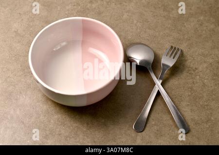 Minimalistic Bowl and Cutlery Set on Neutral Background Stock Photo