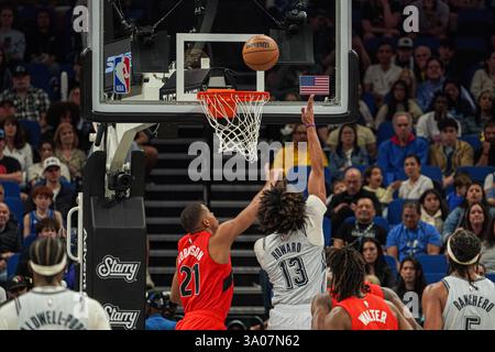 Orlando Magic guard Jett Howard (13) goes to the hoop as he is defended ...