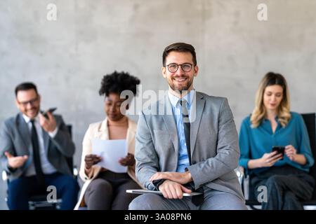 International workers group and team leader having teamwork discussion managing project at work Stock Photo