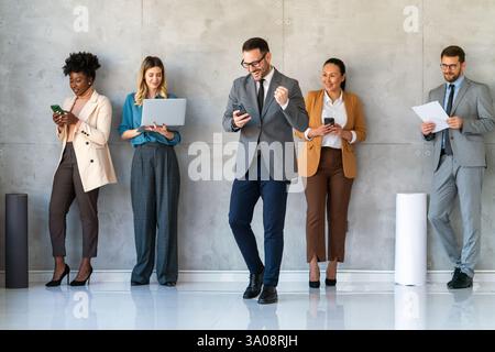 Team of programmers writing digital code in the metaverse and working together on the internet Stock Photo