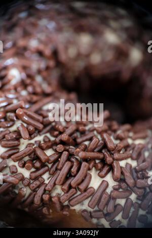 Close-up of chocolate sprinkle on a donut. Stock Photo