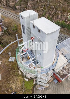 Construction of concrete towers with scaffolding on a building site, crane visible, extension of the ZOB Calw tower on the new track of the Hermann He Stock Photo