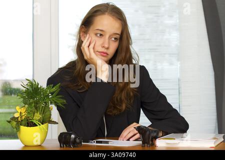 Boss boss junior boss at desk, woman 20, years, office, office work, student Stock Photo