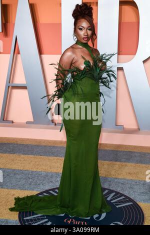 Megan Thee Stallion walking on the red carpet at the 2022 Vanity Fair Oscar  Party held at the Wallis Annenberg Center for the Performing Arts in  Beverly Hills, CA on March 27,