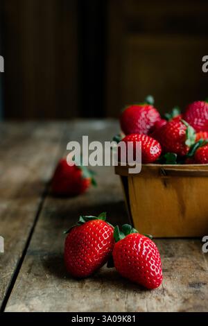 Fresh juicy strawberries in a vintage wooden container Stock Photo - Alamy