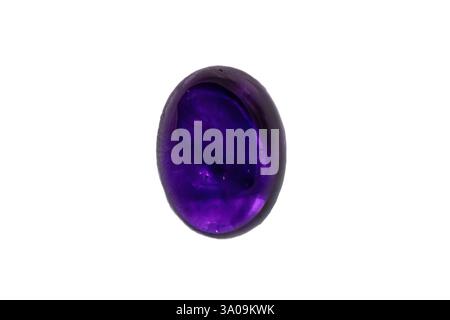 Amethyst oval polished cabochon from Uruguay; deep, rich purple hue. 14x11mm, 7.6 carats. White background. Stock Photo