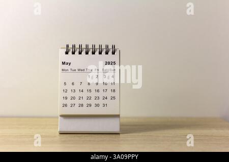 Hello, May. The planning calendar for May 2025 is on your desktop Stock Photo