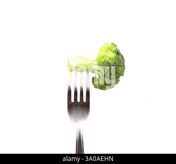 Broccoli impaled on a fork. White background. Stock Photo