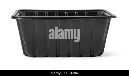 Studio shot of a black disposable plastic food container, highlighting its rectangular shape and ribbed texture Stock Photo