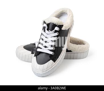 Close-up of fashionable black  sneakers featuring a cozy fur lining, ideal for staying warm in style Stock Photo