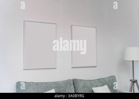 Interior in a light style, templates for two paintings on the wall, photo Stock Photo