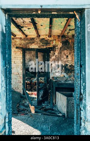 Burned down house, detail of the room after arson, selective focus Stock Photo