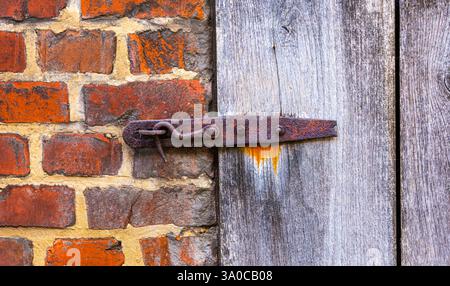 Rusted barn door lock Stock Photo