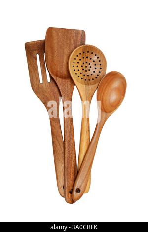 A set of four beautifully crafted wooden kitchen utensils, including spoons and spatulas, arranged together on a white background. The utensils displa Stock Photo
