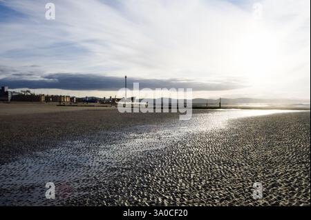 Sun going down over Rhyl Beach, Rhyl, North Wales Stock Photo
